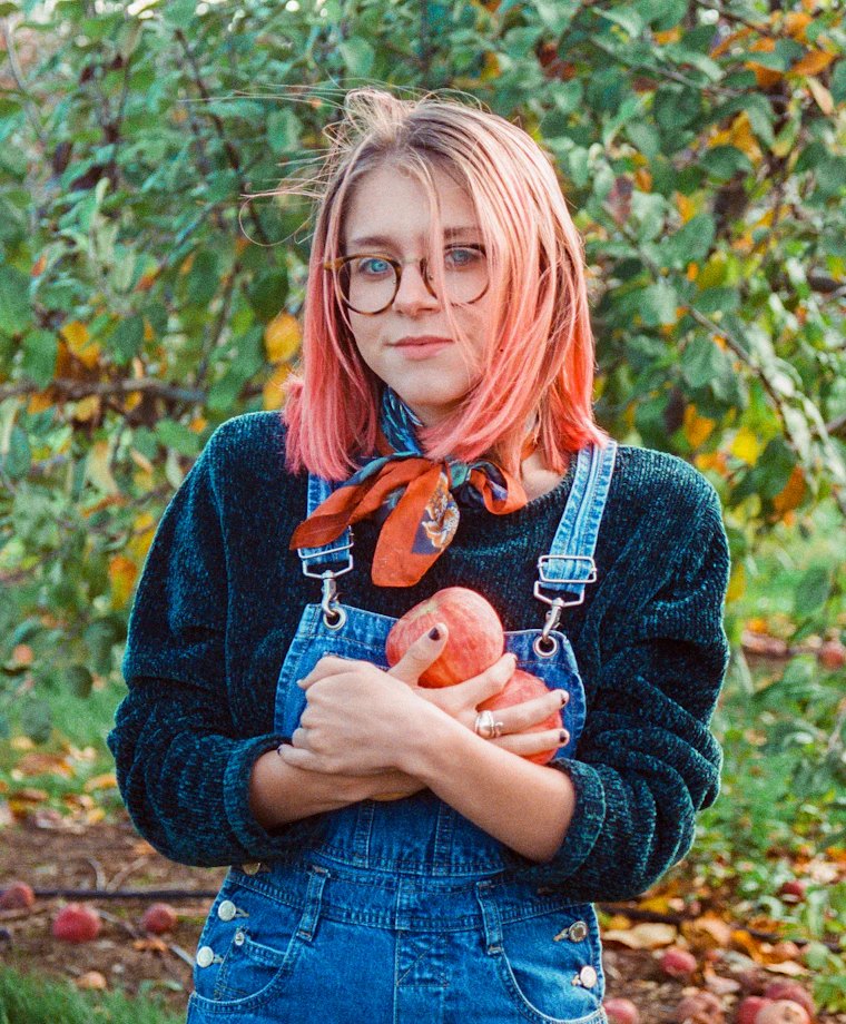 Woman holding fresh apples